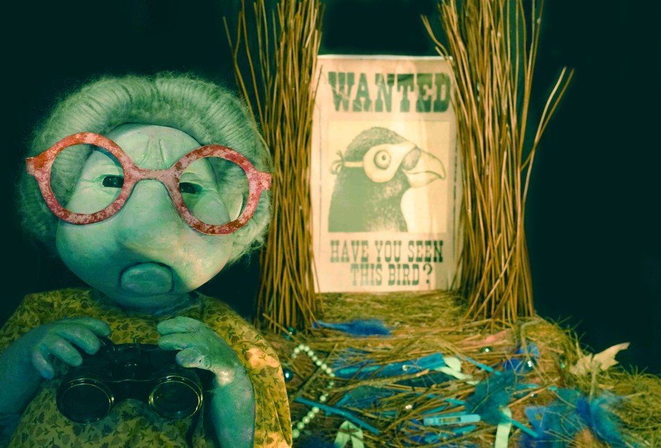 A Little Bit of Blue image with puppet and 'wanted' sign. 