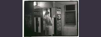 ‘Young woman at the automatic photo booth, Elizabeth Street entrance, Flinders Street Station’, picture: Marlow, Jesse, 1999-2000
