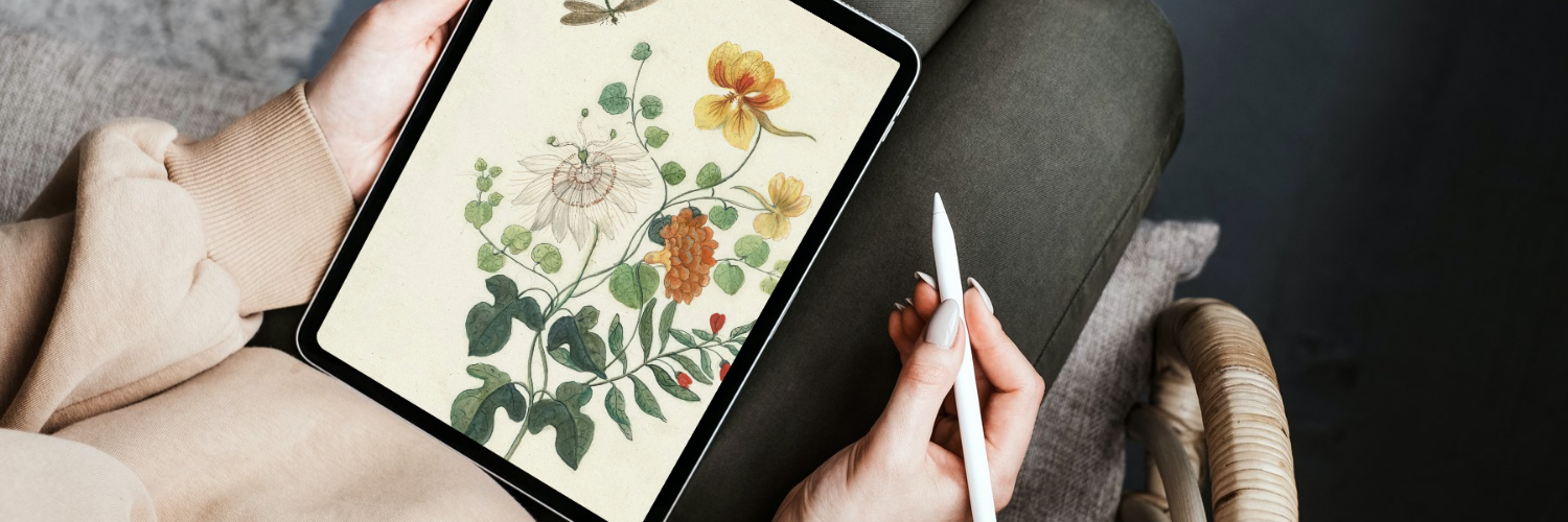 someone using an ipad to draw flowers
