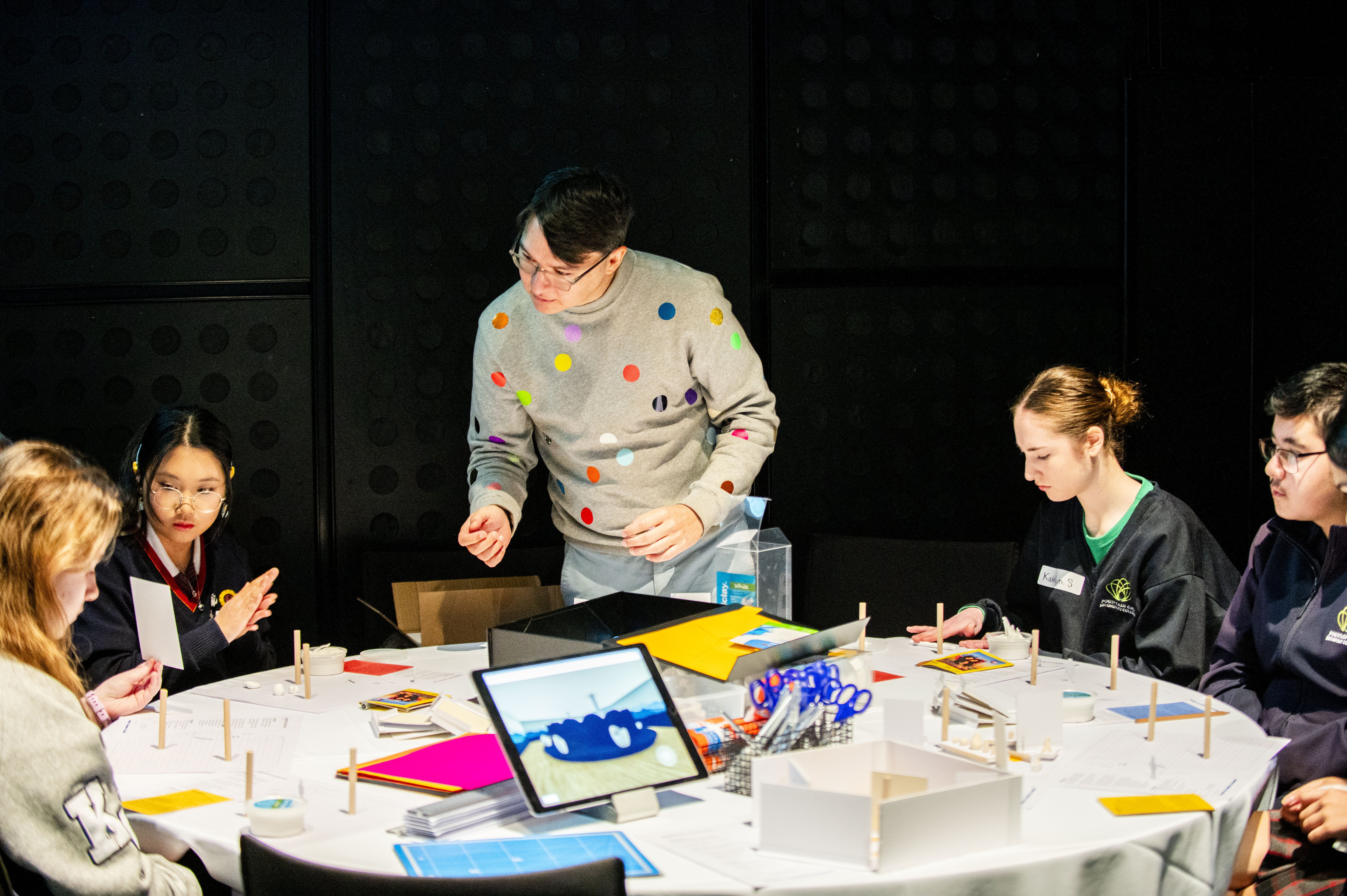 students participating in a workshop with architect and designer kelwin Wong