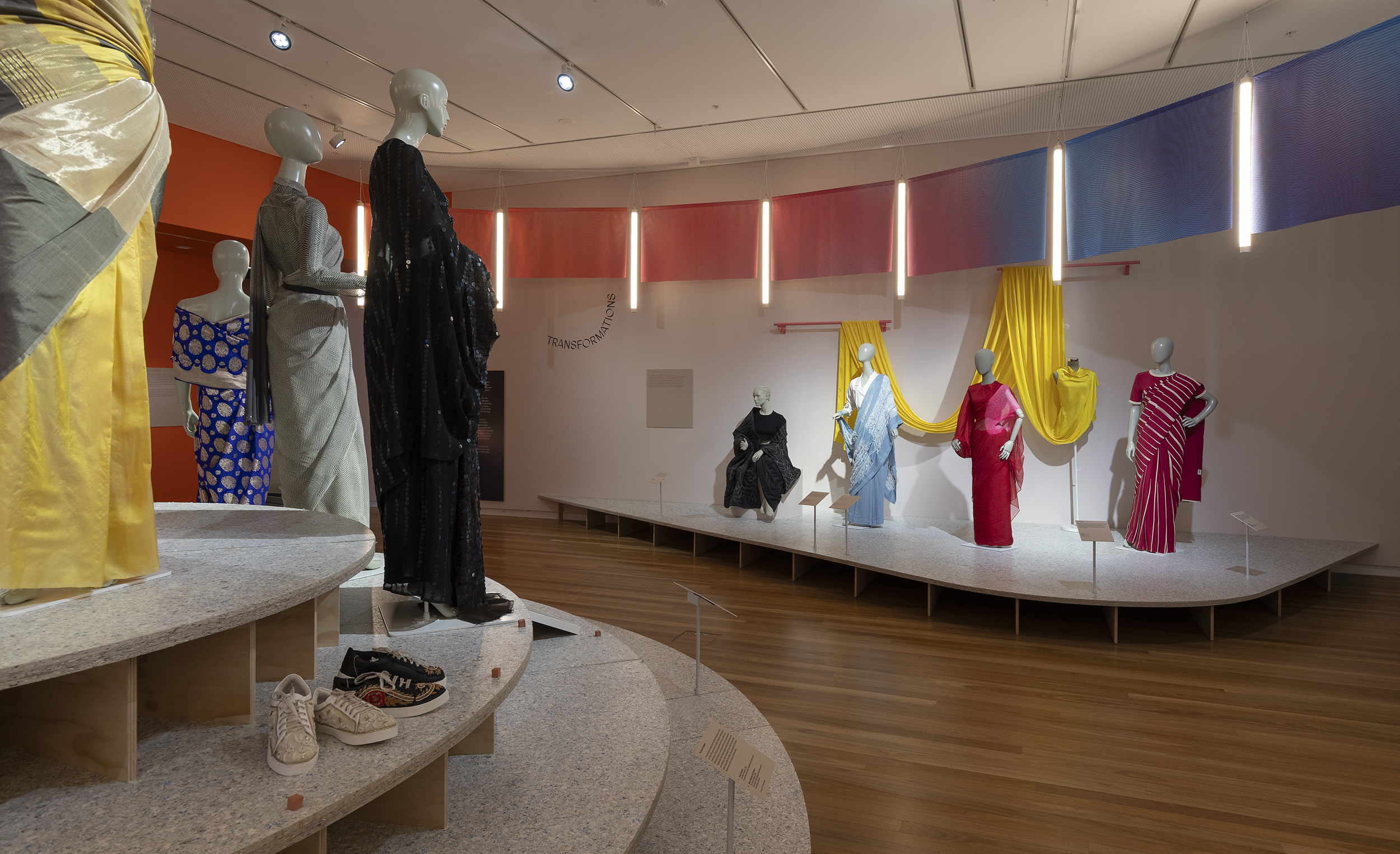 installation view of The Offbeat Sari featuring a range of contemporary saris displayed on mannequins