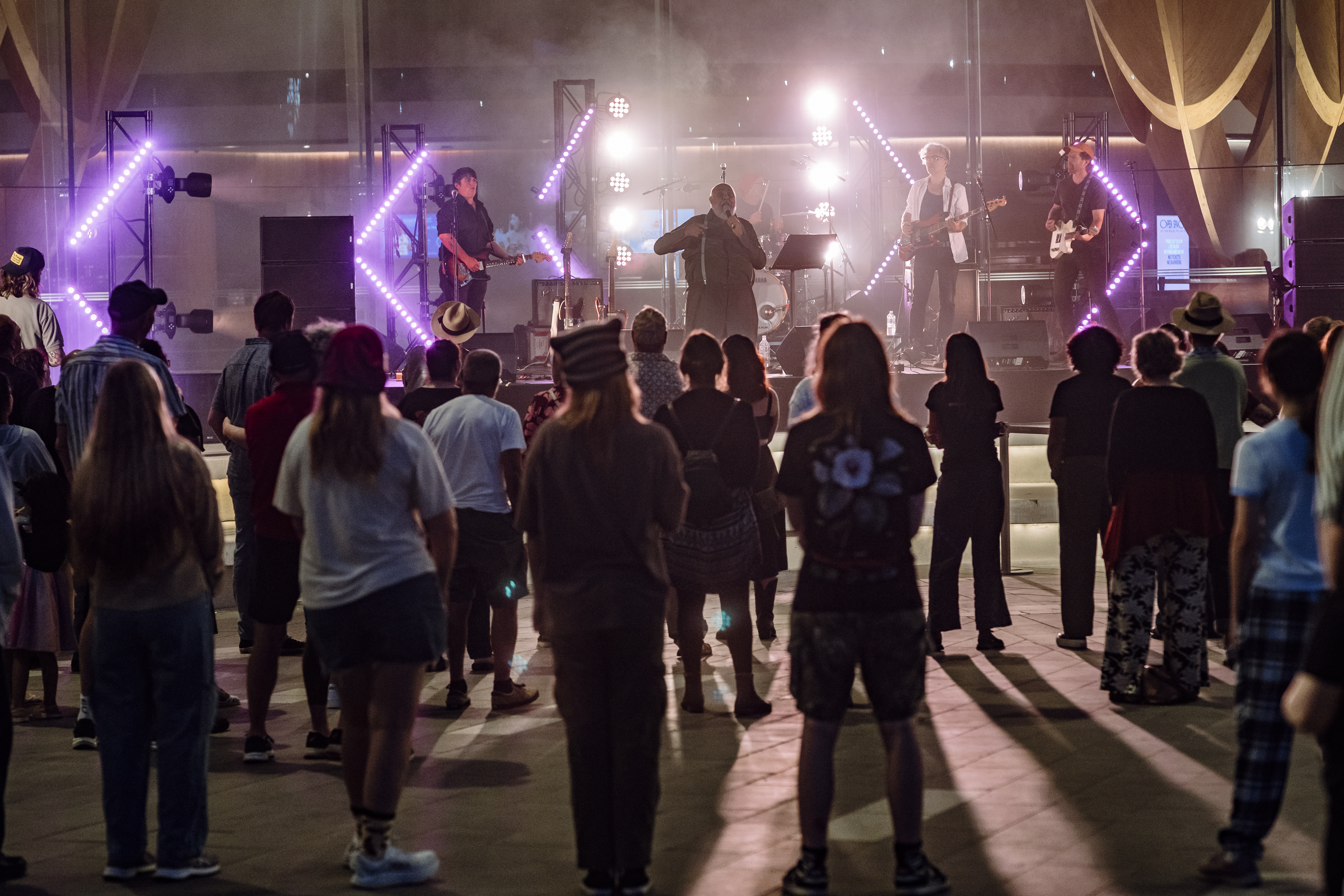 A crowd gathers at Open Space