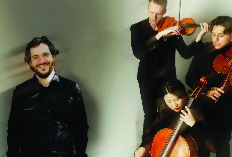 Three musicians in top right corner playing violin and cello, a blurred man in bottom right, with a light green background and a 'blurred' affect across image