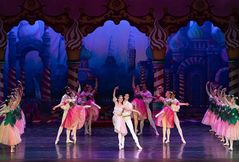 Several rows of ballet dancers on stage performing The Nutcracker