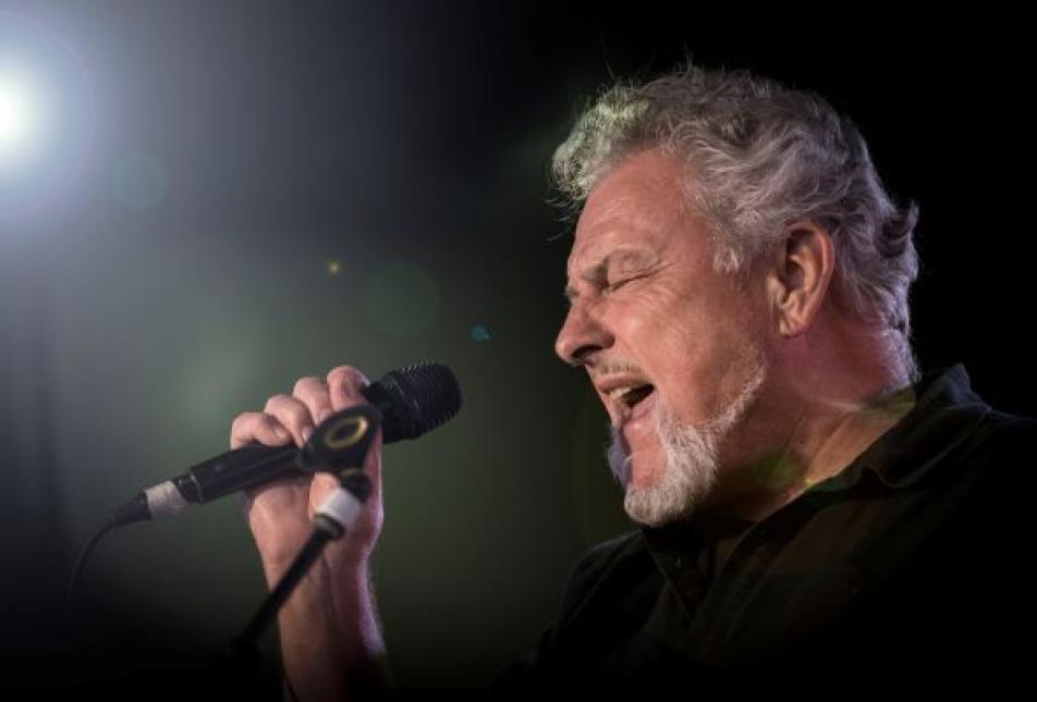 A man singing into a microphone