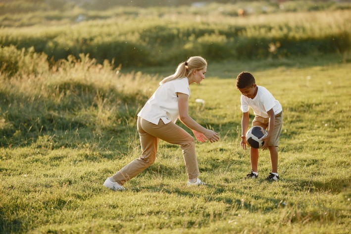 mum and son playing soccer