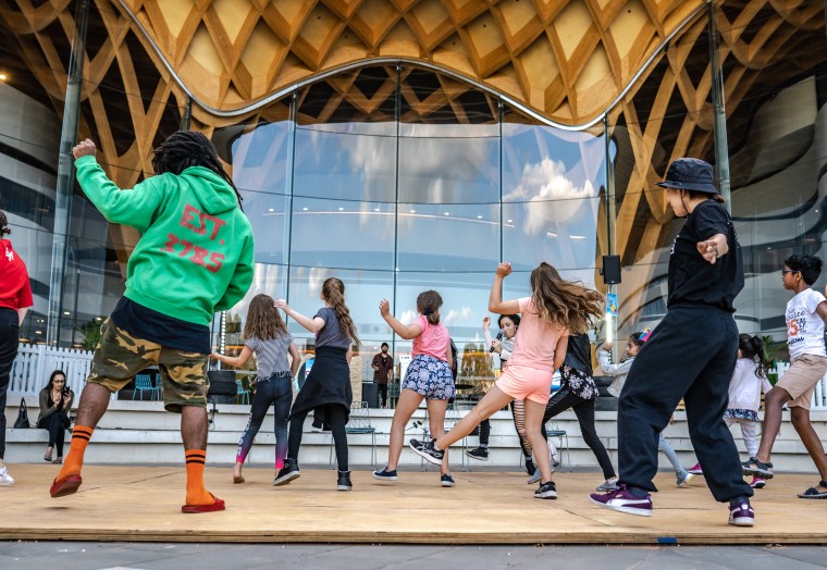 Kids dancing in the Bunjil Place Plaza