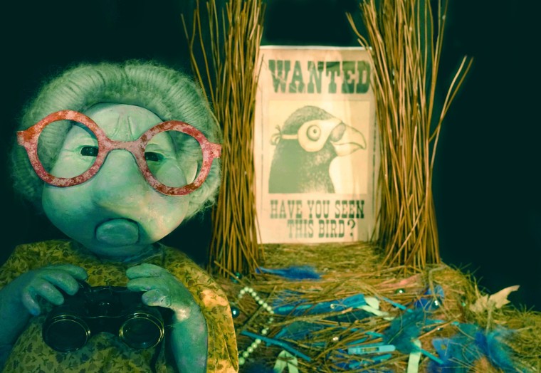 A Little Bit of Blue image with puppet and 'wanted' sign. 