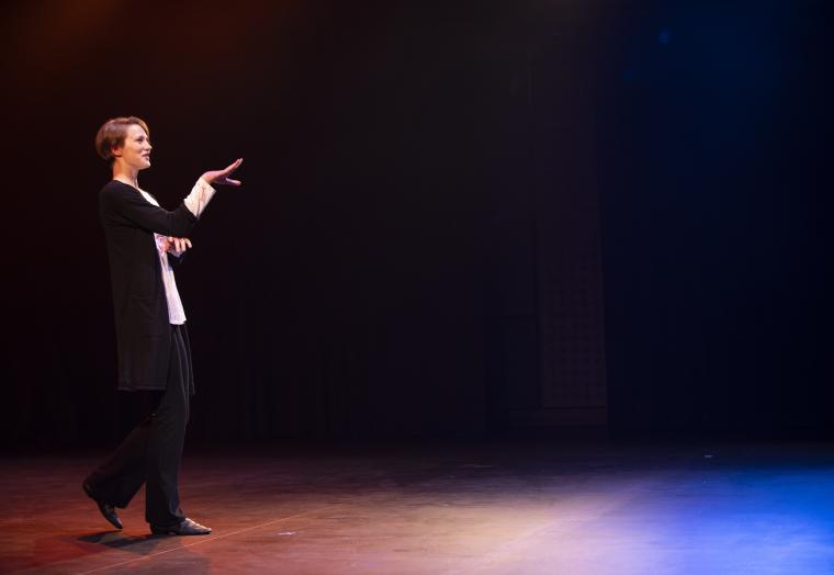 Young person performing theatre on stage