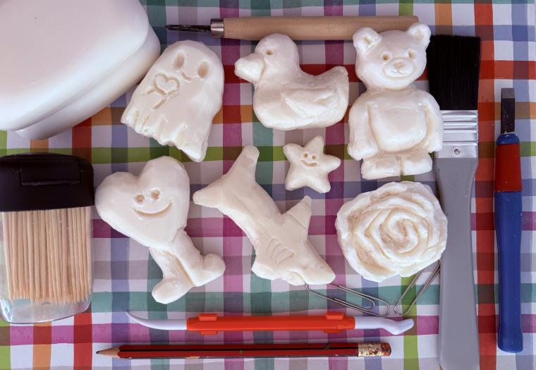 flat lay of soap carvings and tools