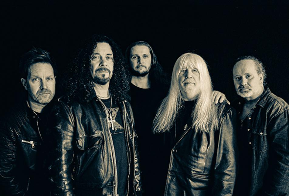 Five men in leather jackets from the band The Sweet