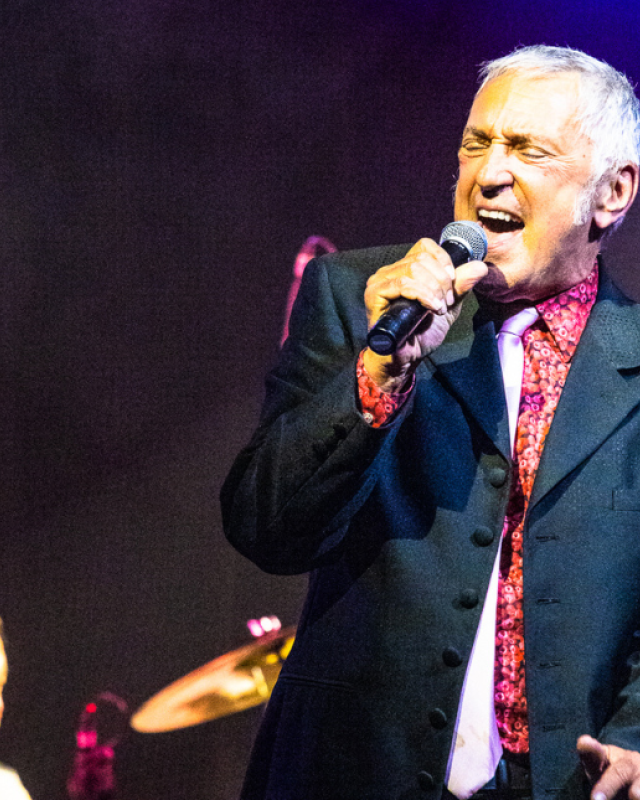 A man singing into a microphone