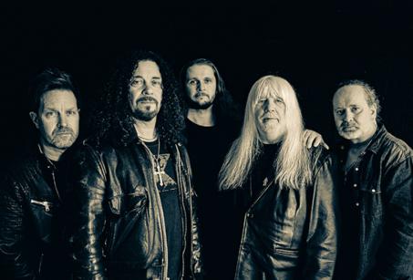 Five men in leather jackets from the band The Sweet
