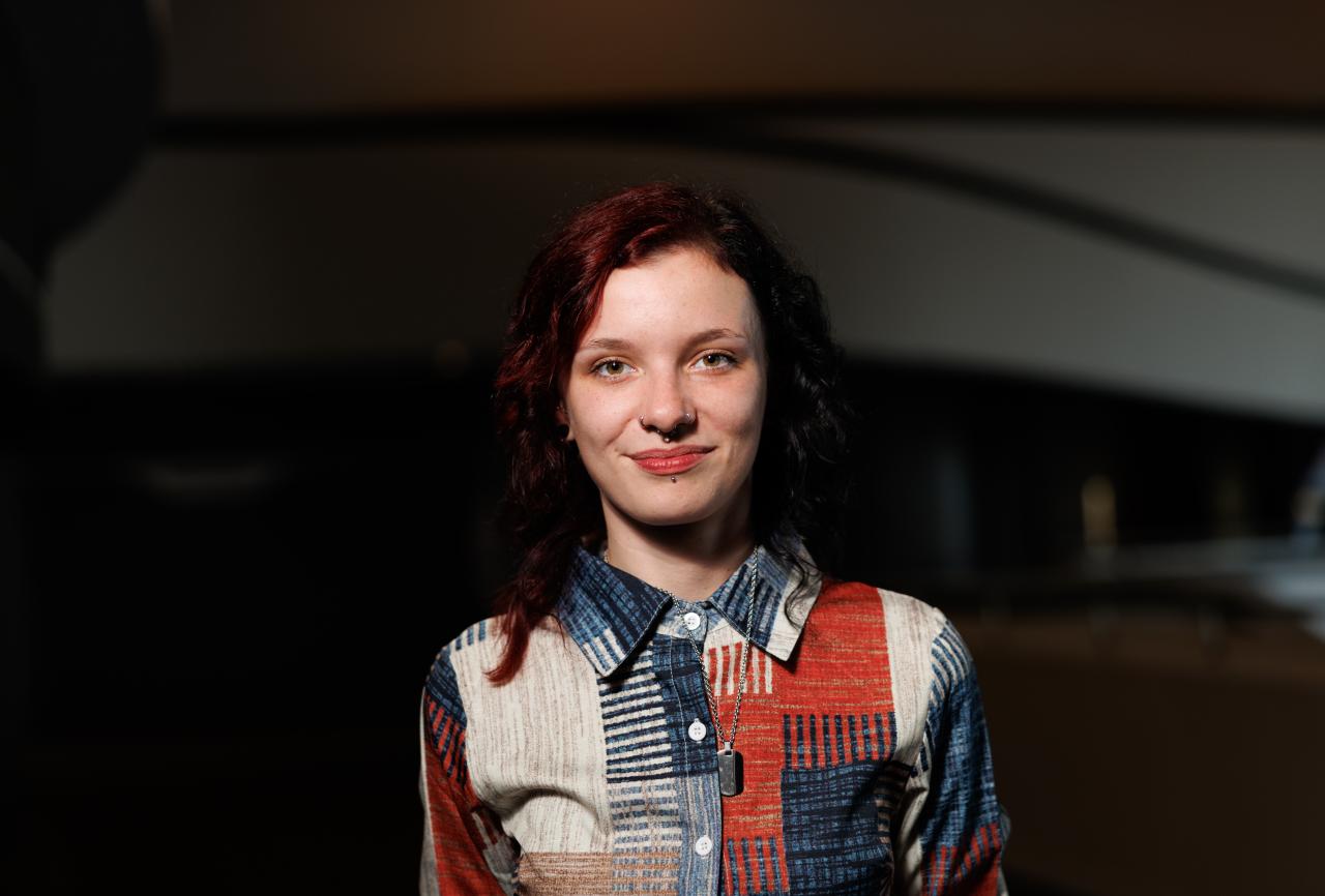 Young person wearing a patchwork top