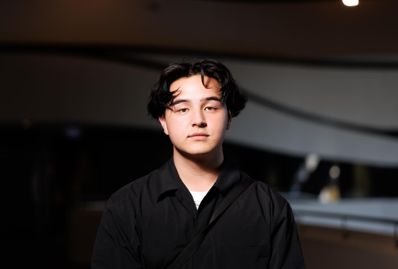 Young person wearing a black shirt