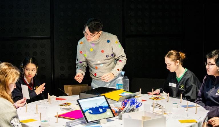 students participating in a workshop with architect and designer kelwin Wong