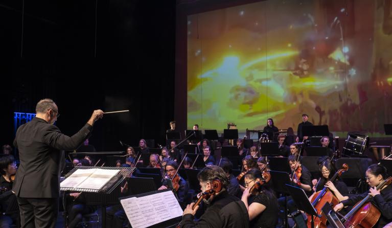 A orchestra performing in a theatre