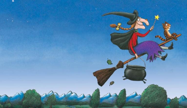 A cartoon image of a witch riding a broomstick