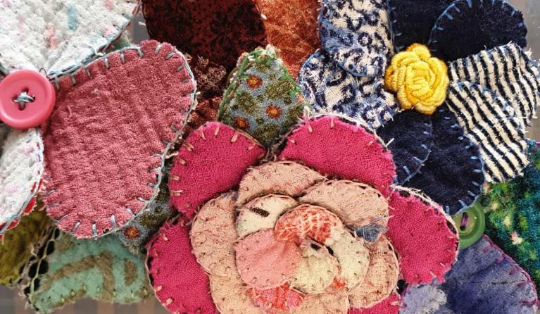 a collection of four fabric flowers
