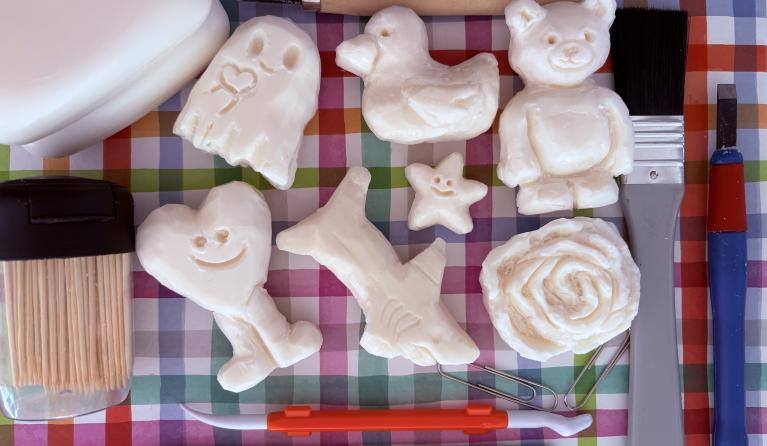 flat lay of soap carvings and tools