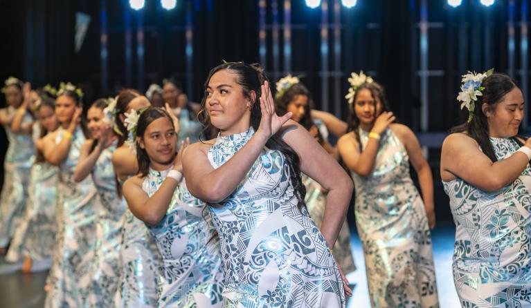 Young dancers on stage during the Cultivating Creative Cultures with Communities 2025 performances.
