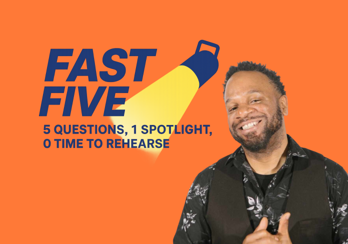 A man smiles at the camera with the words Fast Five written beside him