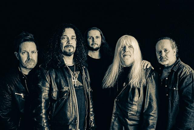 Five men in leather jackets from the band The Sweet