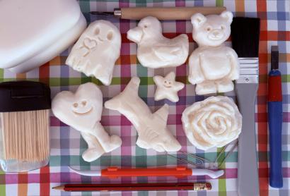 flat lay of soap carvings and tools